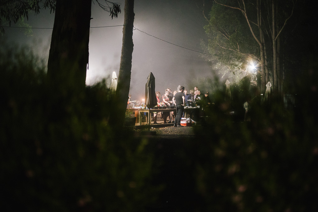 Night photo of people chatting at a BBQ in Kangaroo Valley, NSW