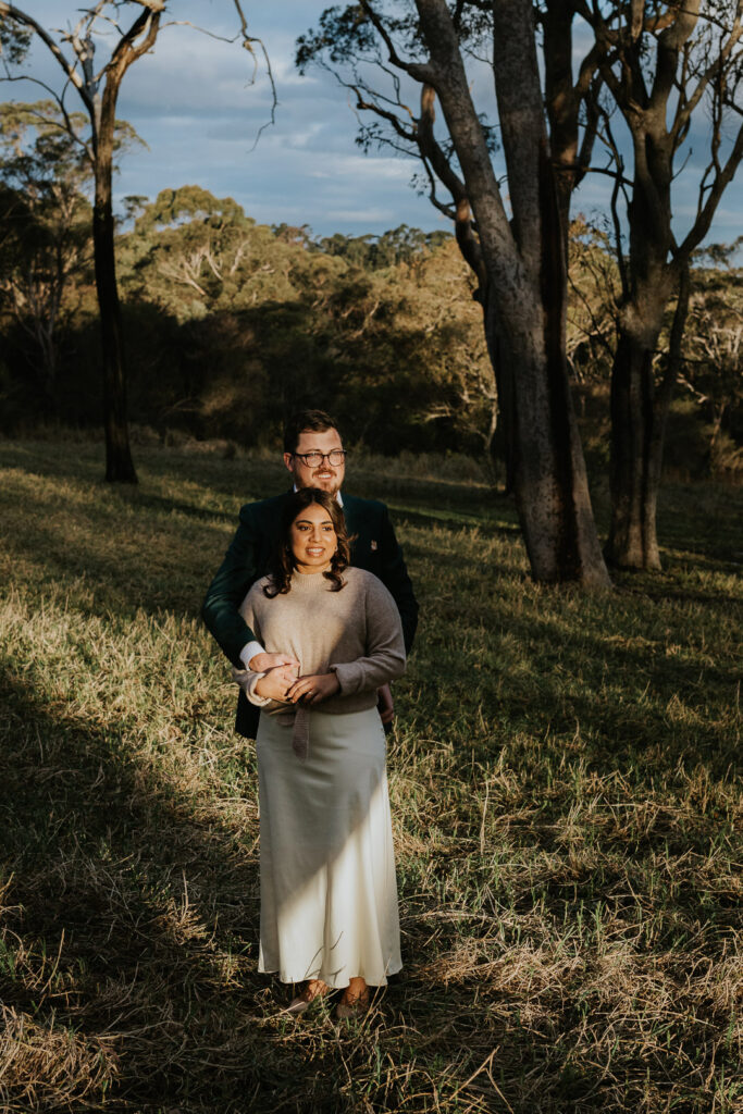 A couple standing in beautiful Winter Light at Glenworth Valley in a Winter Wedding