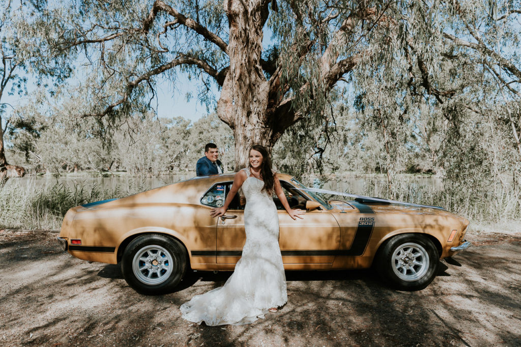 A wedding with a yellow ford mustang in the woods. Albury Wodonga.