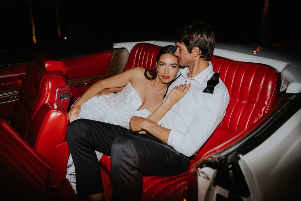 How to choose the perfect Wedding Photographer. Fashion Editorial Photographer. Gorgeous couple in the back of a car at night. Melbourne Australia